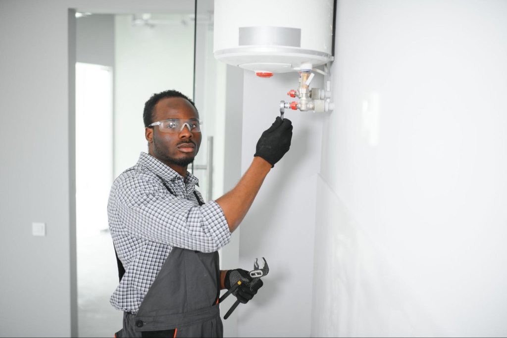 Professional technician performing a home boiler inspection for heating services