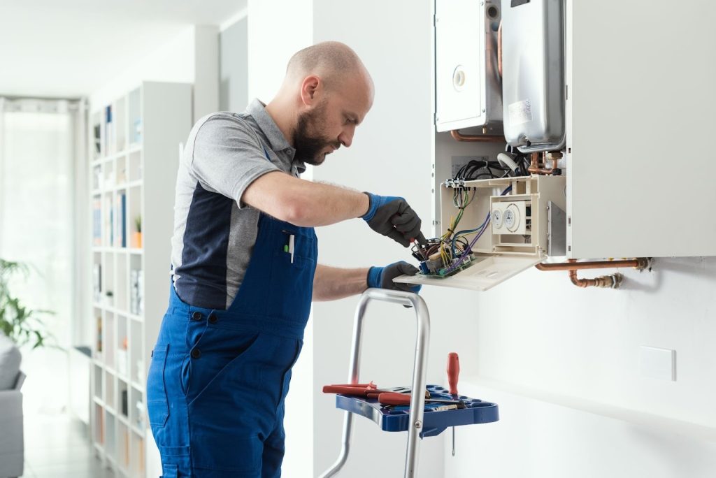 Licensed technician performing furnace service to restore safe heating operation